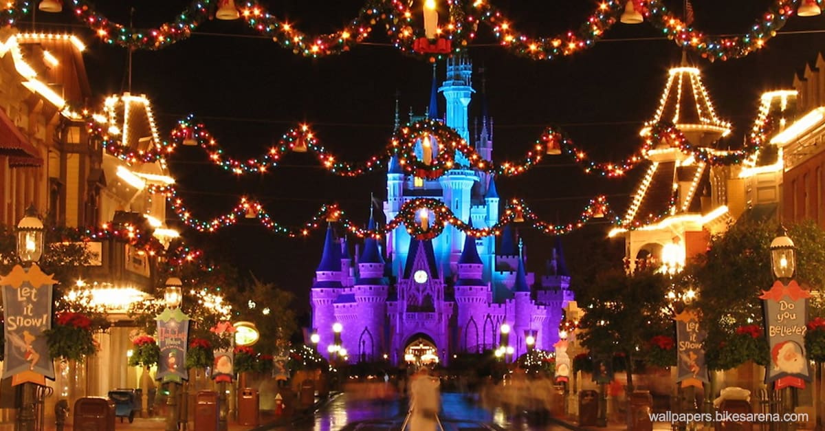 Main Street glows with holiday lights, guiding guests toward Cinderella Castle—pure Disney World Christmas magic.
