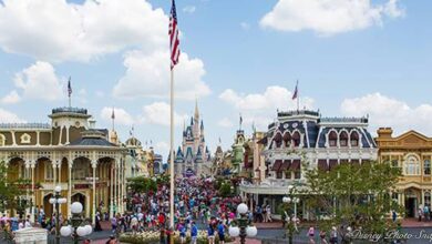 Magic Kingdom guests fill Main Street near Cinderella Castle, surrounded by the charm and excitement of Walt Disney World.