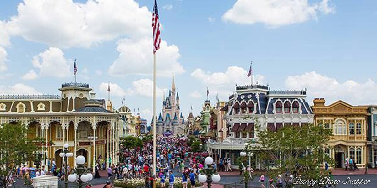 Magic Kingdom guests fill Main Street near Cinderella Castle, surrounded by the charm and excitement of Walt Disney World.
