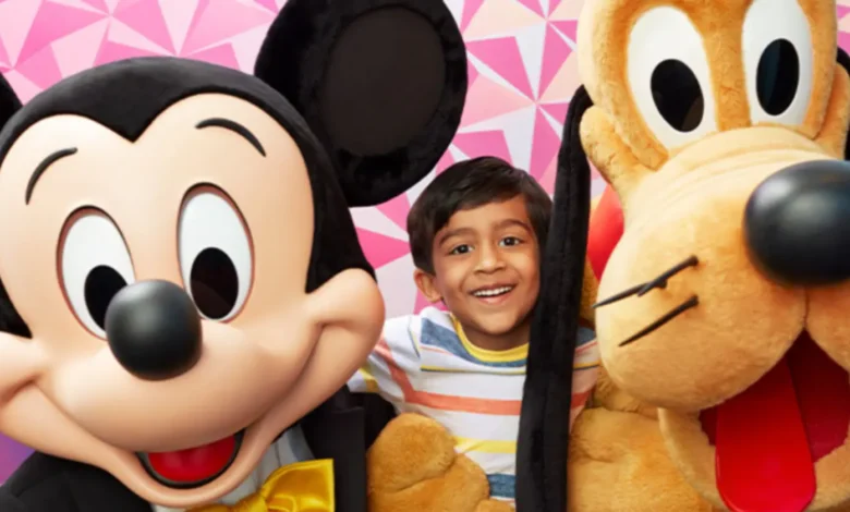child takes a picture with Mickey Mouse and Pluto at EPCOT meet and greet