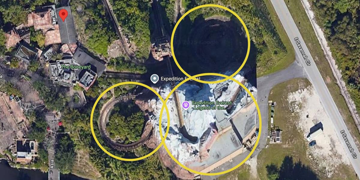 A satellite view of Expedition Everest at Disney's Animal Kingdom, with three yellow circles highlighting parts of the roller coaster and surrounding areas—perfect for fans seeking Hidden Mickey facts among the trees, roads, and nearby attractions.