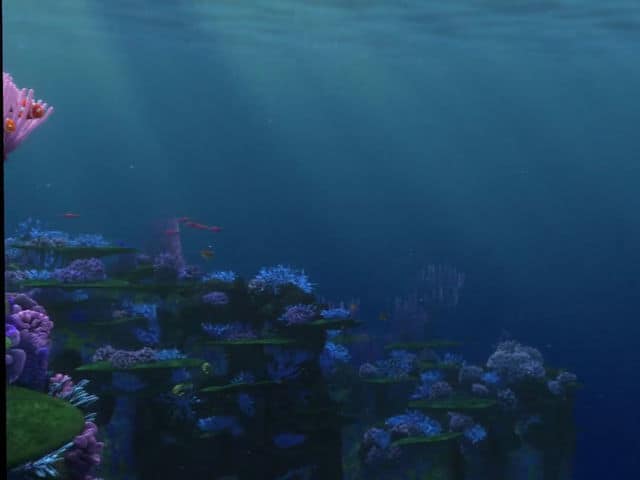 Immersive underwater display with vibrant blue coral and pink sea plants, glowing in sunlight—just like classic Disney scenes.