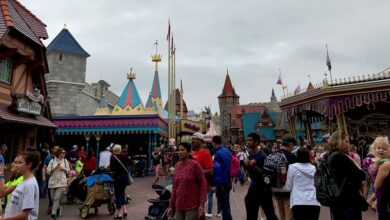 Guests stroll through Magic Kingdom’s lively Fantasyland