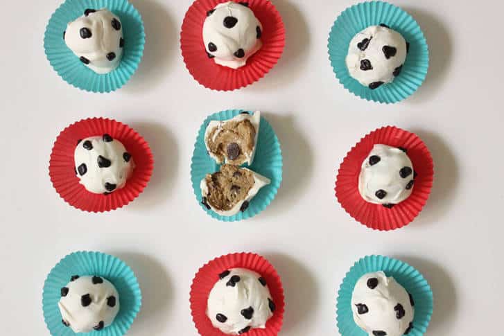 Nine soccer ball cookie dough truffles in colorful liners, one cut open—score big at your next Disney or Universal theme party!.