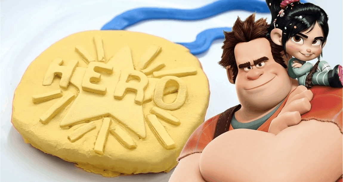 A yellow Hero Medal Cookie with Wreck-It Ralph and Vanellope figures, perfect for Disney park fans and movie-themed treats.