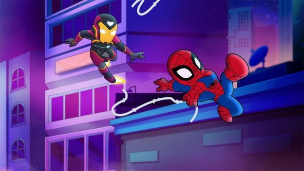 Spider-Man swings above city lights as Iron Man soars nearby in a Marvel Super Hero Adventures night scene fit for Disney Parks fans.