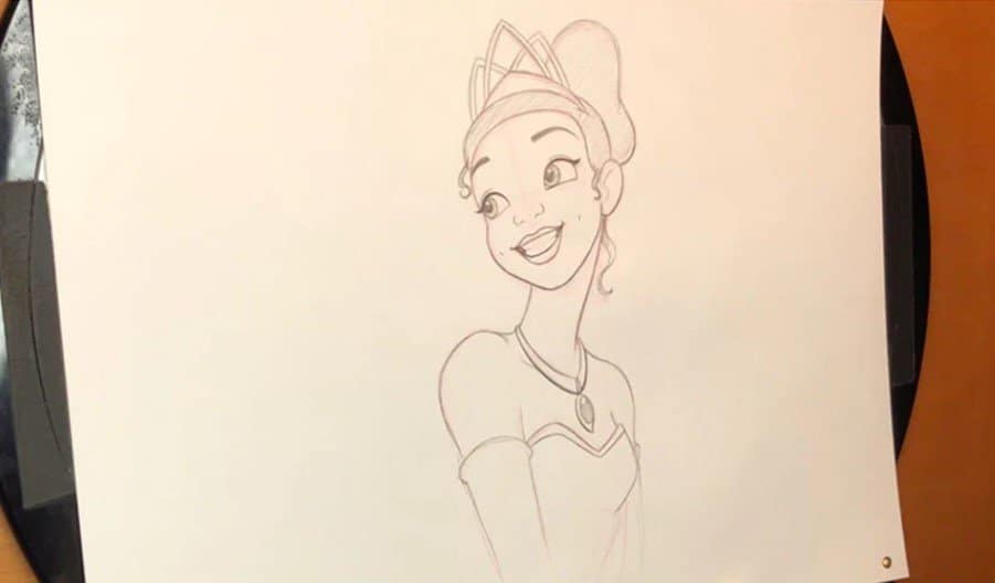 A sketch of Princess Tiana smiling in her crown and necklace, drawn on white paper like a Disney Parks character portrait.