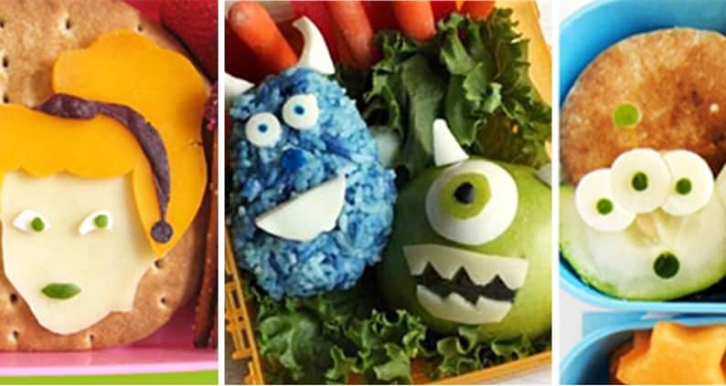 Lunchboxes showcase playful monster faces crafted from fruit, veggies, cheese & crackers—a magical Disney parks lunch idea.
