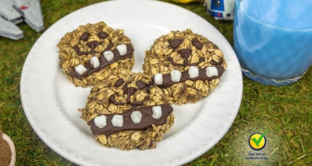 Chewbacca-themed oatmeal cookies with chocolate and white icing, served on a white plate—Wookiee treats fit for Galaxy’s Edge.