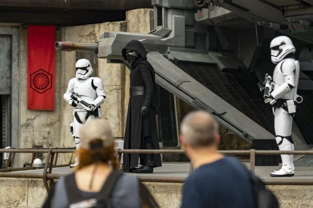 Kylo Ren and two stormtroopers appear onstage for fans at Star Wars: Galaxy’s Edge during a special Hollywood Studios celebration.