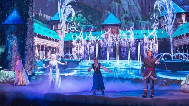 Elsa and Anna dazzle on stage at Disney’s Hollywood Studios, with icy palaces and sparkling fountains bringing Frozen magic to life.