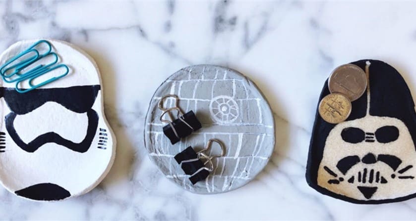 Three Star Wars-themed clay dishes on marble, perfect as galactic catch-alls for coins and clips, ideal for Star Wars fans.