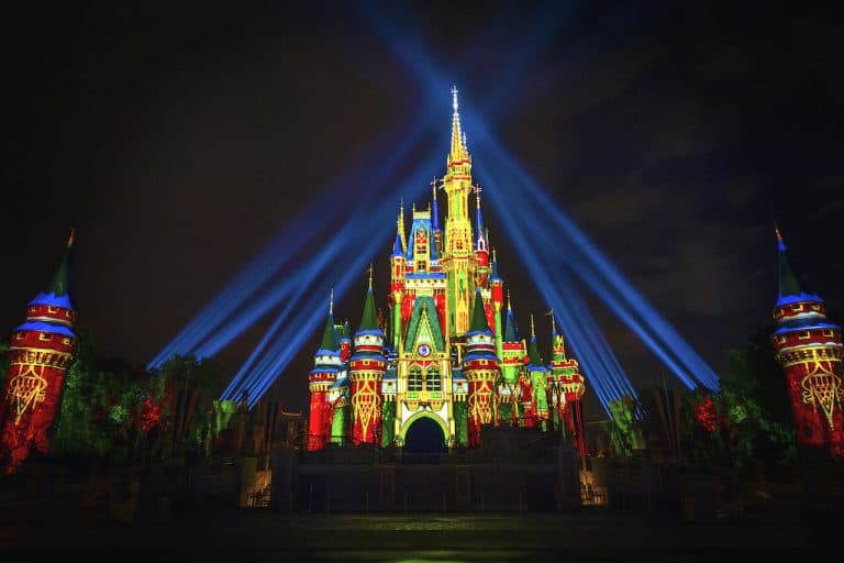 Nighttime spectaculars light up Cinderella Castle with dazzling projections and beams, bringing the Magic Kingdom to life.