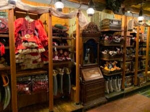 Wooden shelves brimming with pirate costumes, hats, swords, and plush toys set the stage for an immersive Disney shopping adventure in Magic Kingdom, inviting fans to dive into the swashbuckling spirit of their favorite attractions.