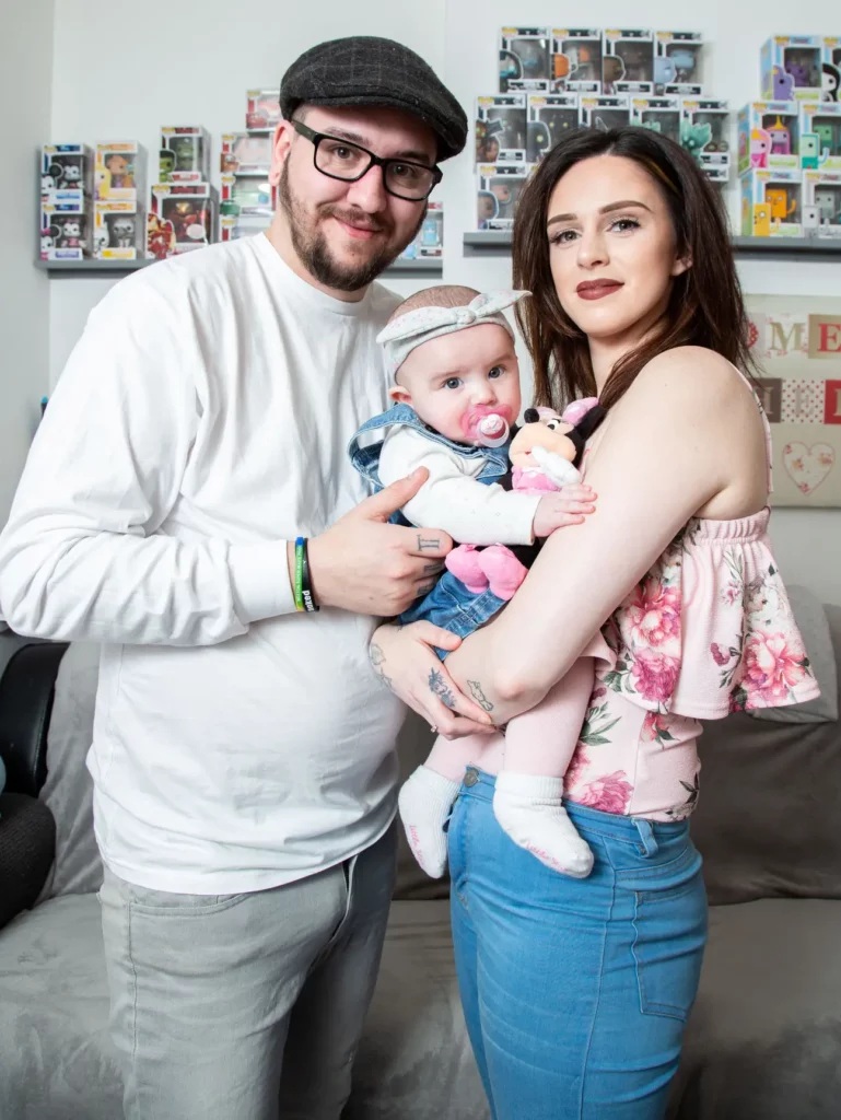 Jade and Joshua Jeanes with their daughter, Disney