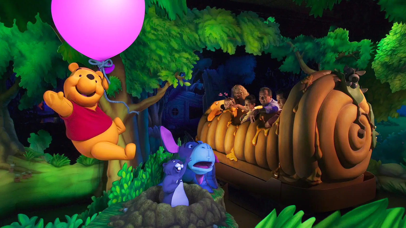 A cheerful scene featuring Winnie the Pooh holding a pink balloon and floating through a vividly colored forest. Nearby, characters like Eeyore, Piglet, and Tigger are whimsically posed around a large honey pot with delighted children riding inside, creating an enchanting atmosphere akin to Avatar land in Disneyland.