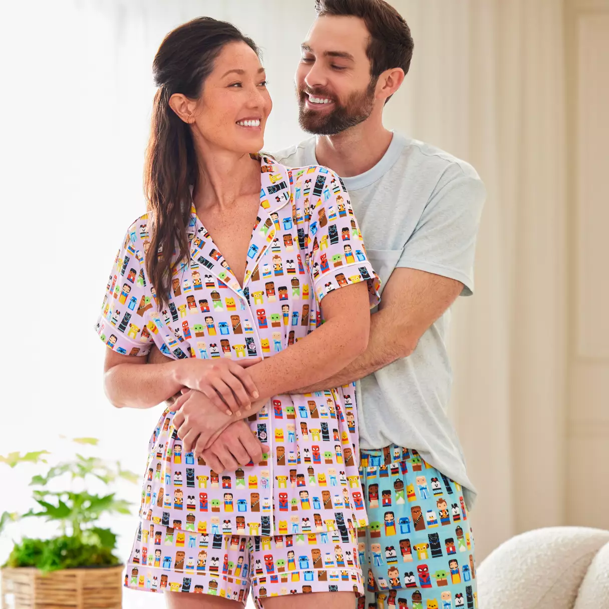man and a. woman in disney sleep wear