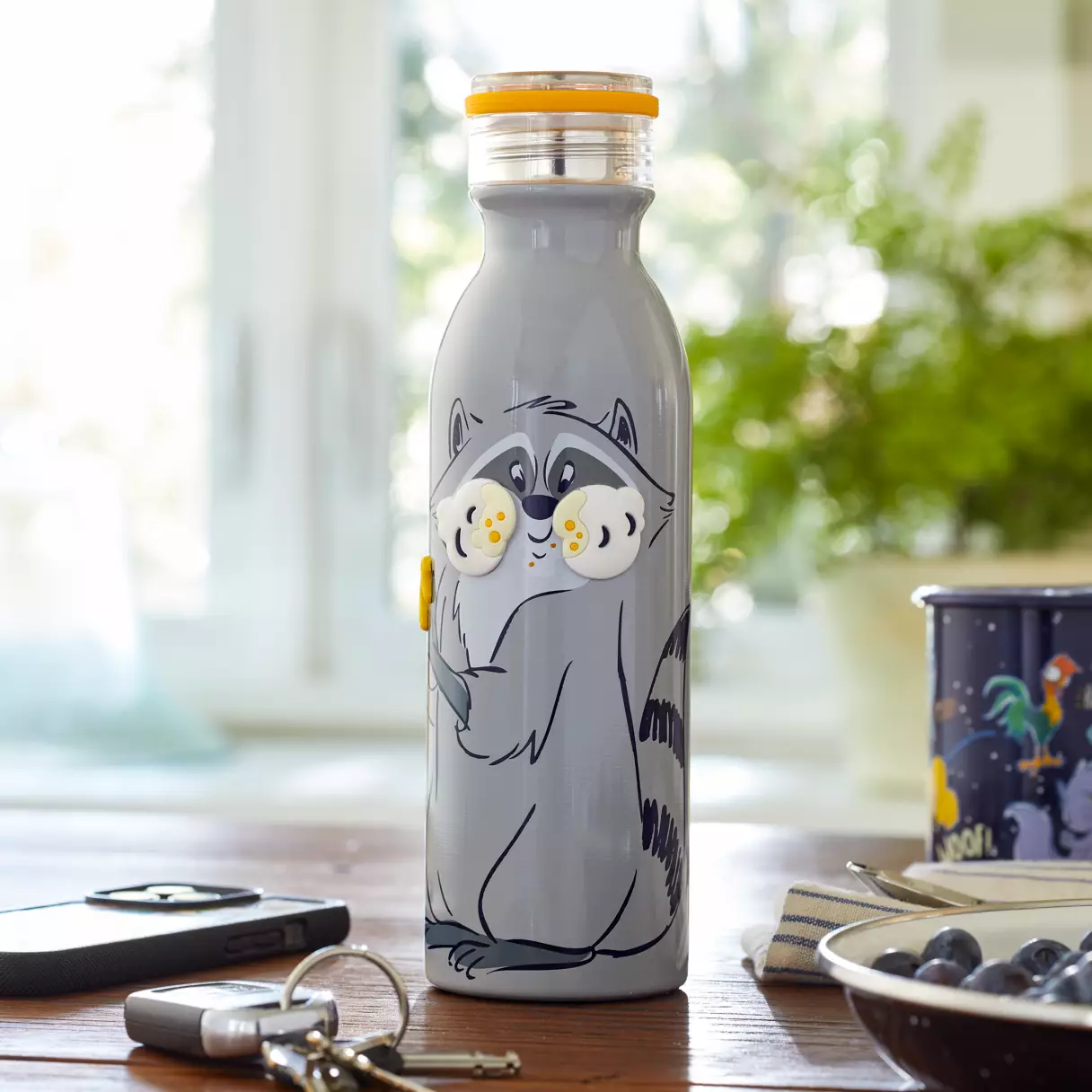 A water bottle with Meeko on it. One of Disney Fanatic's tips is to stay hydrated at Magic Kingdom.