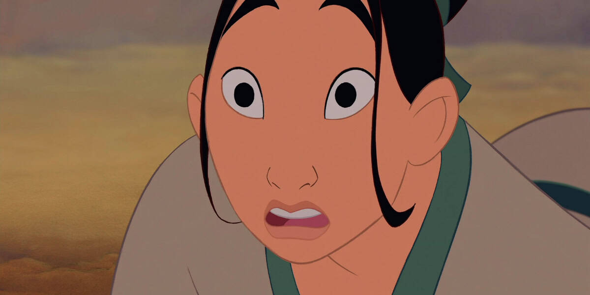 An animated character with wide eyes and a surprised expression is shown in a close-up view. The character has long black hair tied back, with two loose strands framing the face, giving off an air reminiscent of Lea Salonga in her dressing room. The background is blurred, featuring earthy tones.