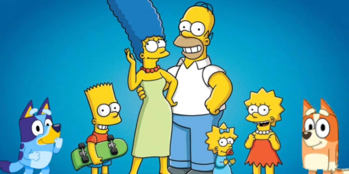 The Simpsons Family all standing and posing together in front of a blue screen, inside of Disney World.