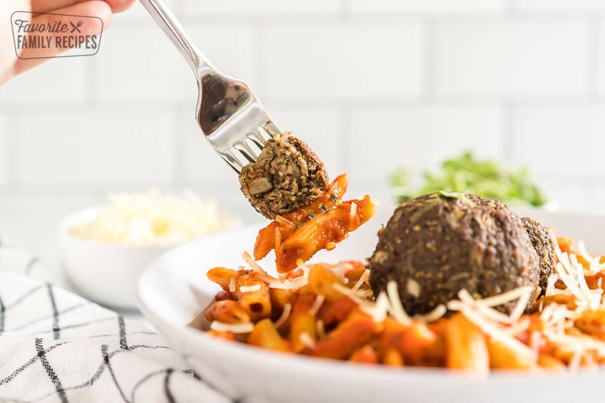 This copycat Pym Test Kitchen Impossible Spoonful recipe will transport you right back to Avengers Campus. Plus, it is completely plant-based! A spoonful of impossible meatball and pasta.