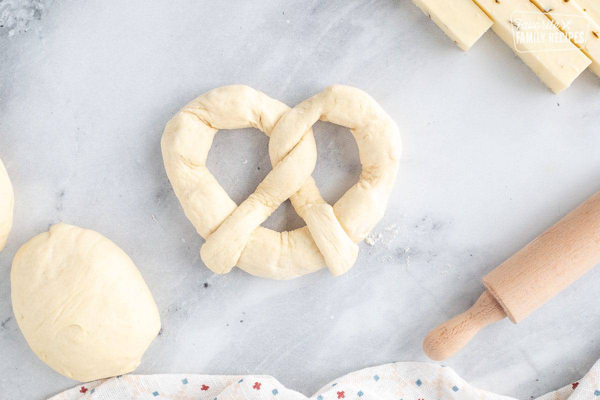 The Jalapeno Cheese Stuffed Pretzel is one of my very favorite treats at Disneyland. Now you can have this spicy, cheesy taste of Disney at home! Dough shaped like a pretzel.