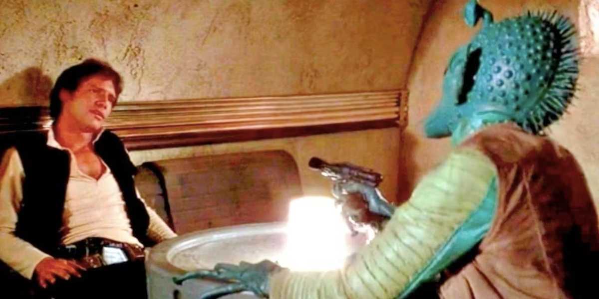 A human character wearing a white shirt and black vest sits at a table, appearing relaxed but tense, while facing an alien creature with green skin, spikes on its head, and holding a blaster. The scene is set in a dimly lit, rustic space cantina.
