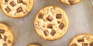 Jack Jack’s Cookie Num Num-inspired chocolate chip cookie muffins, topped with chunky chocolate squares, freshly baked and ready to enjoy straight from the Pixar Pier–style baking tray.