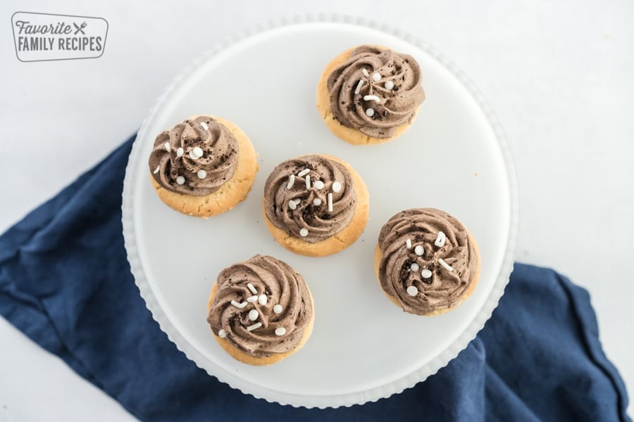 Try the Grey Stuff - it's delicious! This famous treat from Disney's Beauty and the Beast is full of smooth, creamy pudding, and crunchy Oreo bits. Grey stuff piped onto cookies and arranged on a platter.