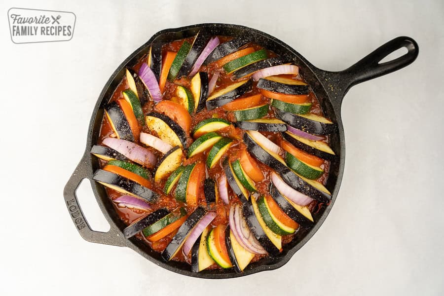 Ratatouille is the best way to enjoy fresh summer vegetables. This dish is delicious, healthy, and packed with flavor. Ratatouille right before it goes in the oven so the veggies are still raw.