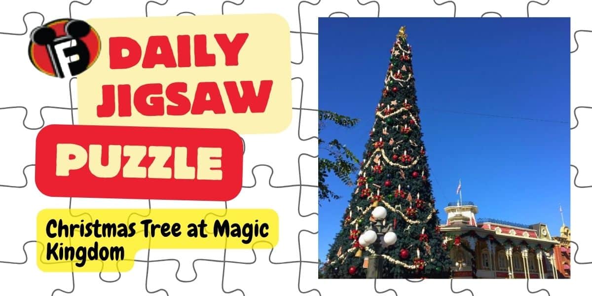 A festive banner reads "Daily Disney Jigsaw Puzzle" next to an image of a decorated Christmas tree at Magic Kingdom against a clear blue sky. The tree is adorned with ornaments and garlands, standing beside a theme park building.