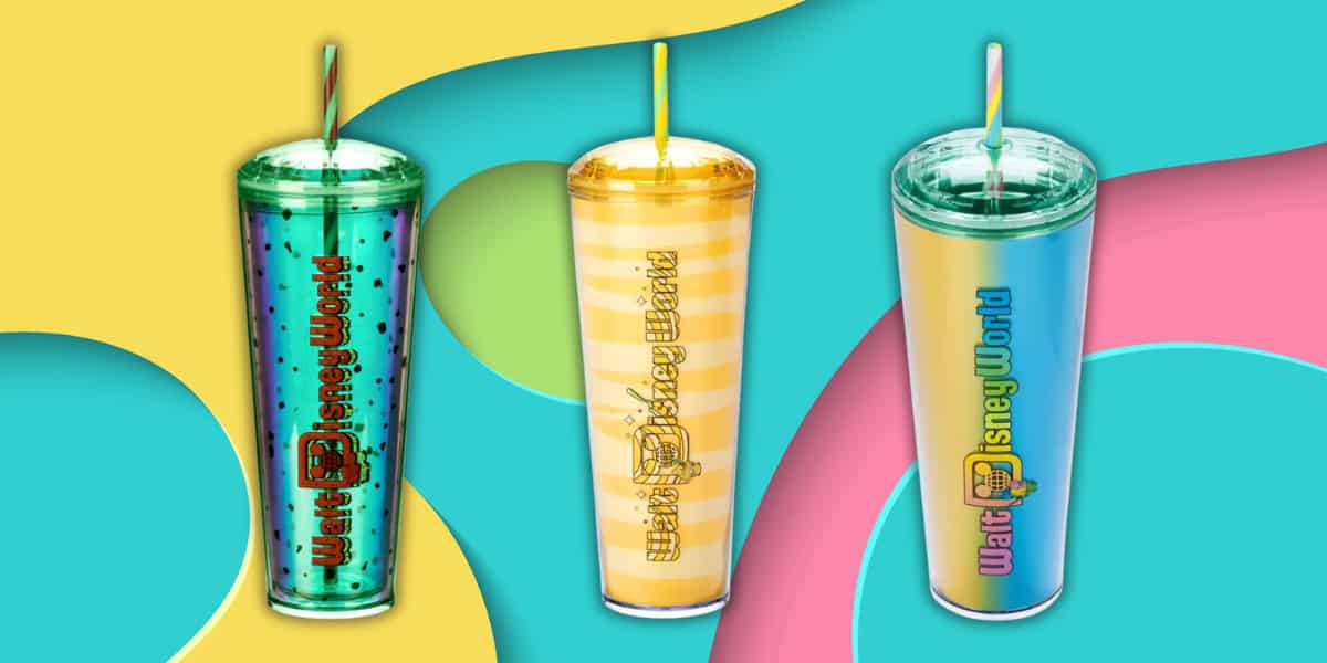 Three colorful tumblers with straws stand against a vibrant background. The left tumbler is green with black dots, the middle is yellow with stripes, and the right is a gradient of blue to pink. Each features the text "Walt Disney World.