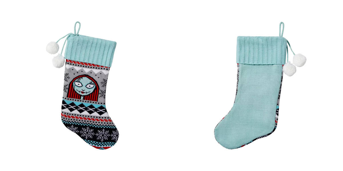 Two Christmas stockings on a white background. The left stocking features a design with snowflakes and a cartoon face, while the right stocking is plain mint green. Both have knitted cuffs and are adorned with pom-pom strings.