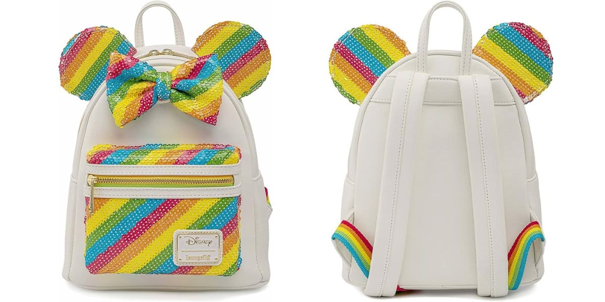 A small white backpack with rainbow sequin rainbow ears and a rainbow bow on the front. It has a rainbow sequin front pocket with a gold zipper and adjustable shoulder straps. There is a Disney logo badge on the pocket.