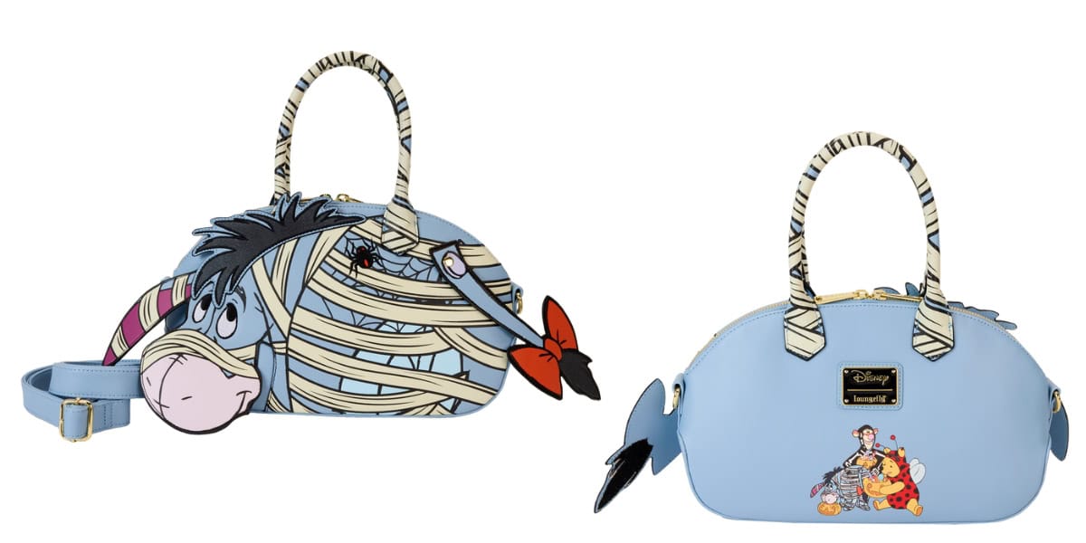 Two cartoon-themed handbags: one shaped like Eeyore wrapped in mummy bandages, and the other a light blue bag featuring Eeyore, Pooh, and Piglet in Halloween costumes. Both have top handles and zip closures.