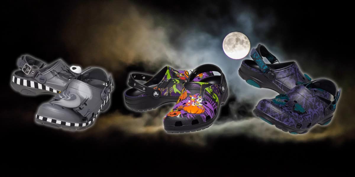 A trio of Halloween-themed clogs is displayed against a spooky night sky with a full moon. The designs include ghostly patterns, pumpkin illustrations, and eerie black and purple motifs.