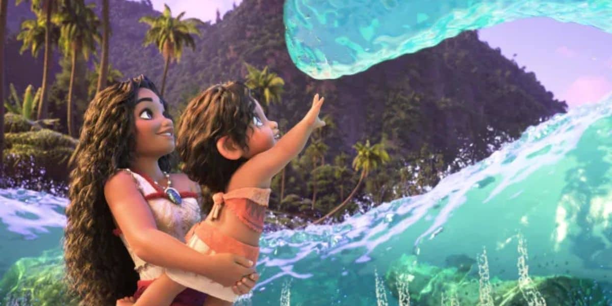 A young woman holds a delighted baby as they face a magical ocean wave in a tropical setting, with lush green mountains and palm trees in the background. The wave is shaped like a friendly hand reaching out.