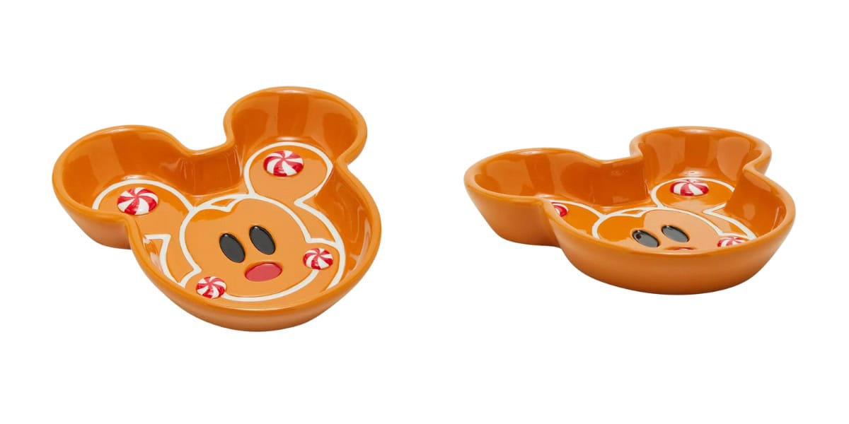 Orange, Mickey Mouse-shaped ceramic candy dishes featuring cute cartoon faces and peppermint candy designs. Two bowls are shown from slightly different angles.