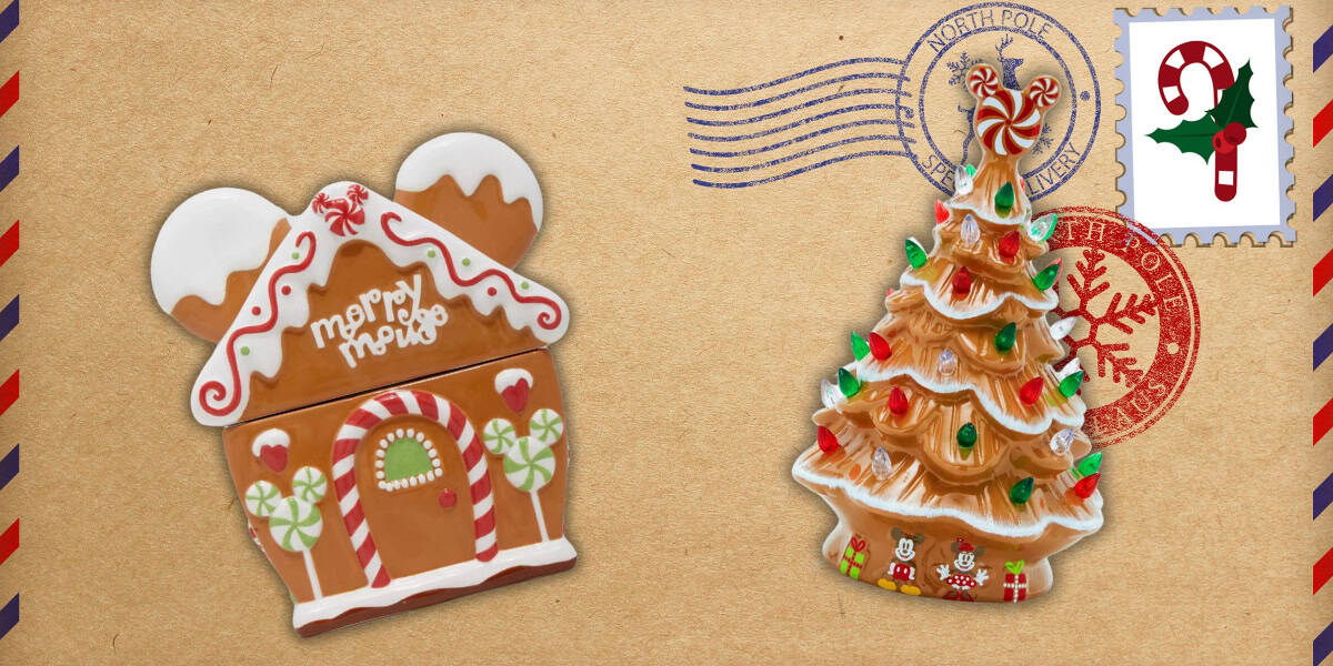 A gingerbread house cookie with candy decorations and "Merry" written on it, alongside a Christmas tree cookie adorned with colorful ornaments, both placed on a festive background resembling an envelope with postal stamps.