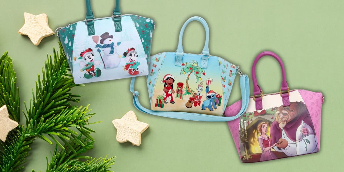 Three colorful handbags with holiday-themed Disney designs are displayed on a green background. A pine branch and star-shaped cookies are placed nearby for a festive touch.