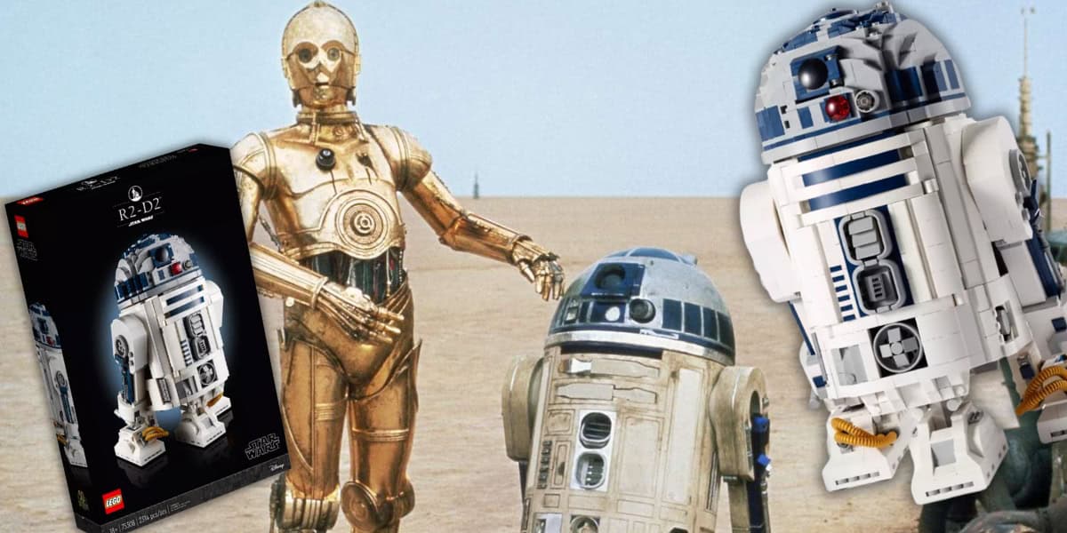 Lego set of R2-D2 with C-3PO and original R2-D2 in a desert scene.