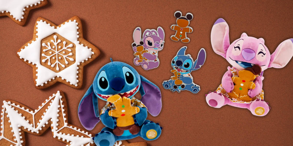 Plush toys of blue and pink creatures holding gingerbread cookies are placed against a brown background with iced star-shaped and zigzag-edged gingerbread cookies. They are surrounded by decorative stickers of similar characters.