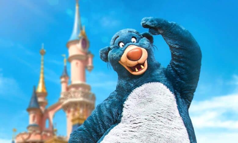 A Disney character performer dressed as Baloo the bear at Disneyland Paris as taxi strikes take place. Disneyland Paris reservation cancellations Disney Adventure World.