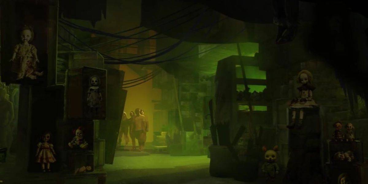 A dimly lit room with eerie green lighting contains several creepy dolls on shelves. Two figures in hazmat suits stand in the background, partially obscured by shadows. The setting appears mysterious and unsettling at Universal Horror Unleashed.