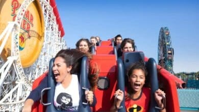 A group of excited people ride the Incredicoaster at Disney California Adventure Park.