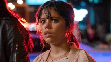 Jenna Ortega looking horrified with police lights in Scream VI