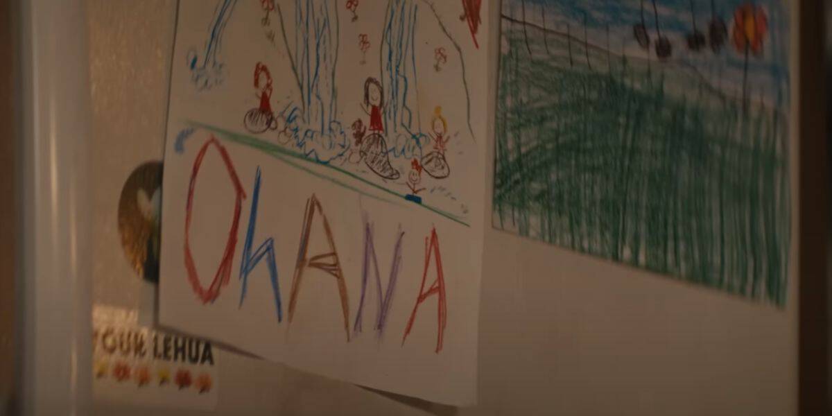 A drawing of a family that reads "'Ohana" from the live-action 'Lilo and Stitch' trailer.