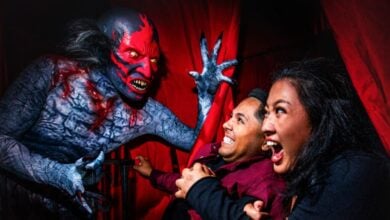 Guests scared by a monster at Halloween Horror Nights