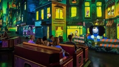 Guests on the Mickey & Minnie's Runaway Railway ride at Disneyland Park.