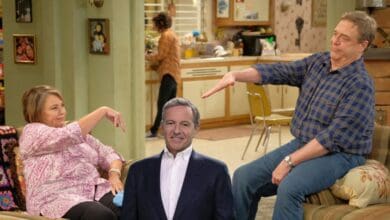 A scene from Roseanne with Bob Iger in the middle
